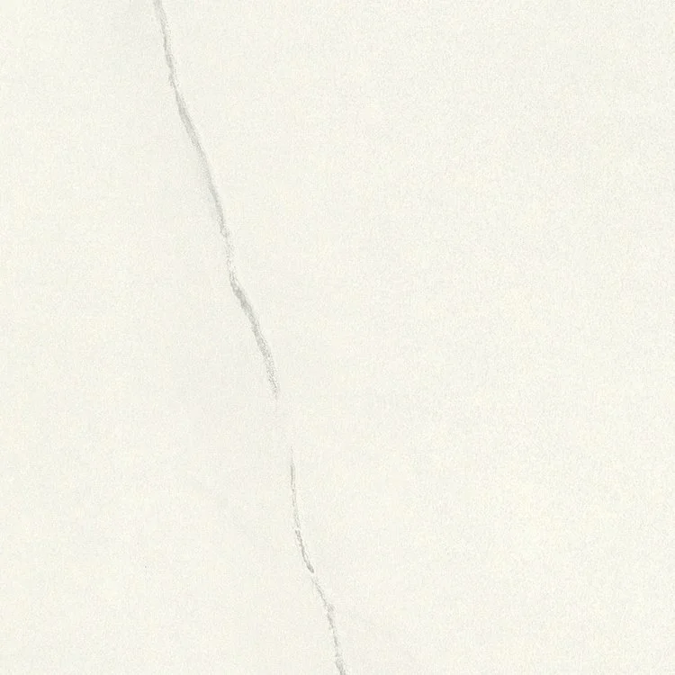 Close-up photo of a cracked white wall or surface.