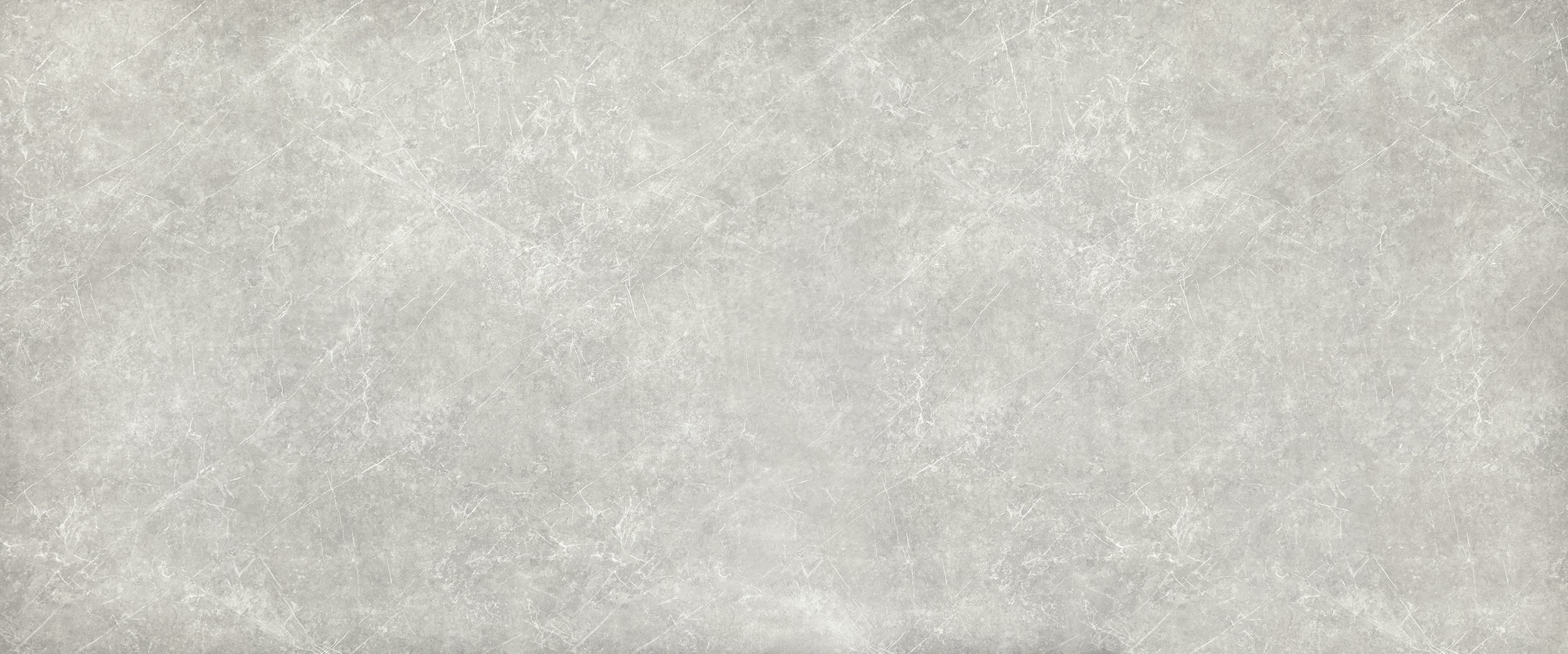 Empty gray marble surface with a textured appearance and faint white veins.