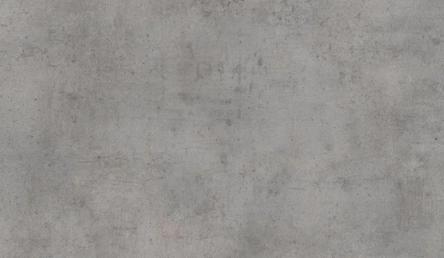 A plain, gray concrete wall surface with a smooth texture.