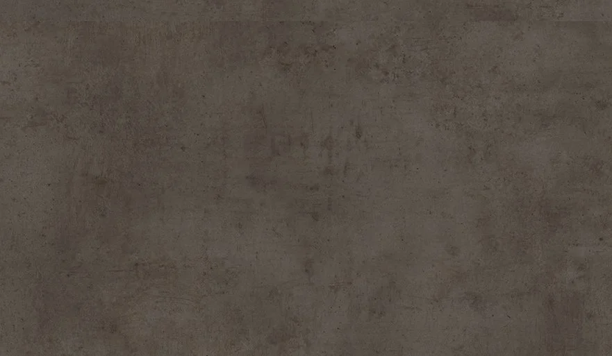 A plain, textured concrete wall.