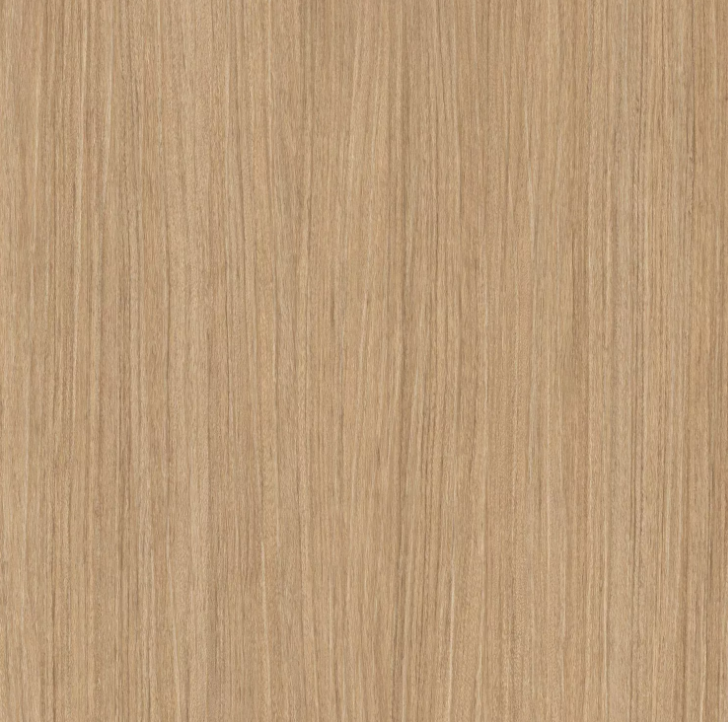 Close-up of a wooden surface or tabletop with a light brown finish and visible wood grain texture.