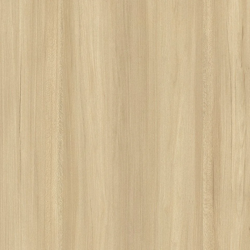 A close-up of a light-colored wooden surface with visible wood grain patterns.