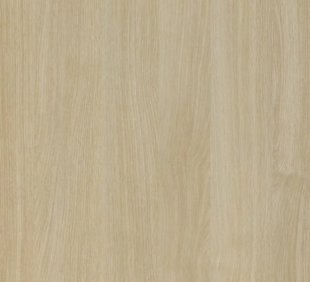 Close-up of a light-colored wood surface with visible grain patterns.