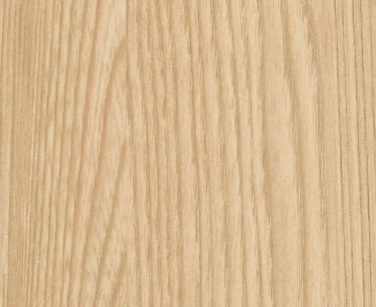 Close-up of a light-colored wooden surface with visible grain patterns.