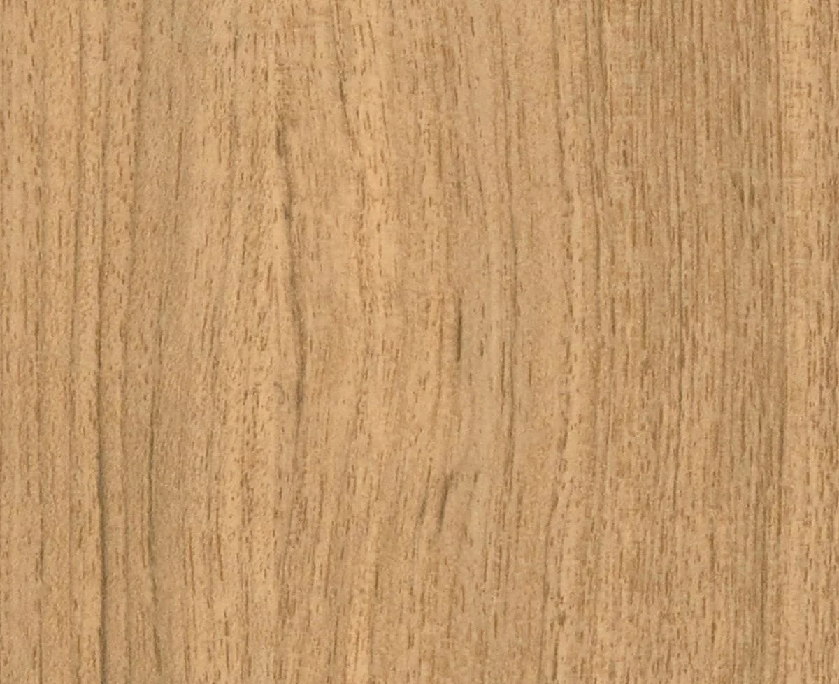 Close-up of a light wood surface with visible wood grain.