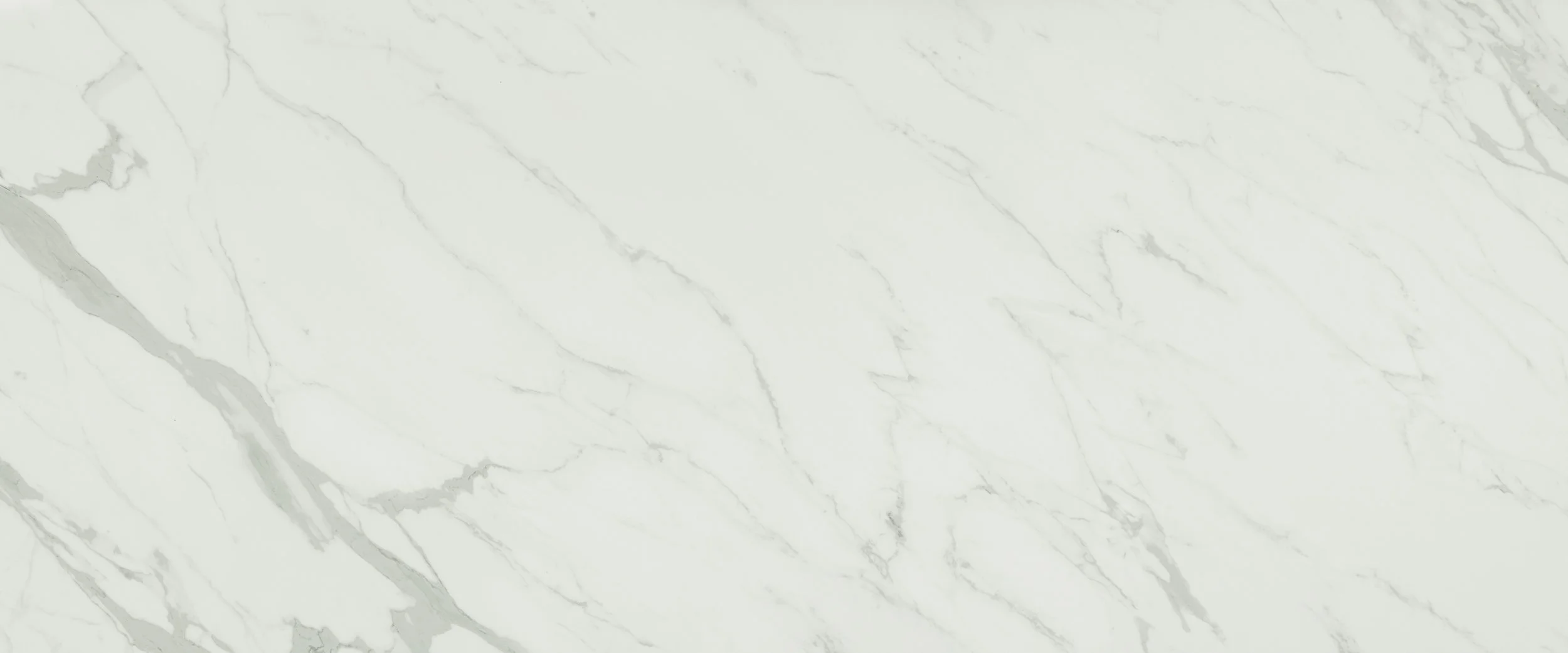 A light-colored marble surface with gray veins.