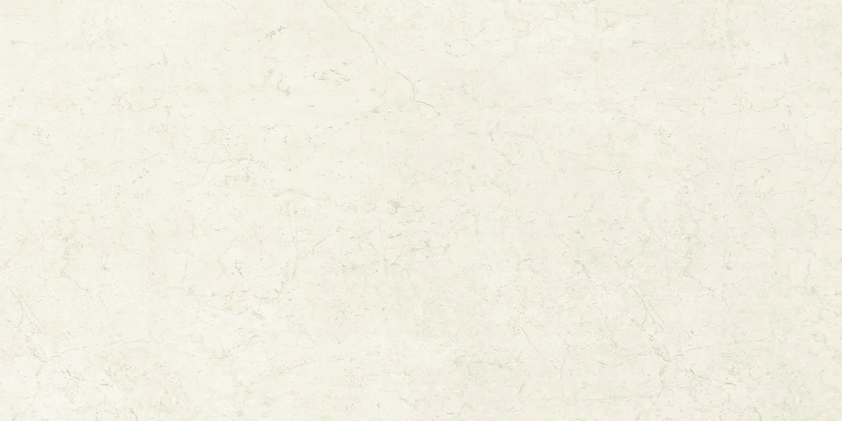 Plain off-white wall with visible cracks and texture.