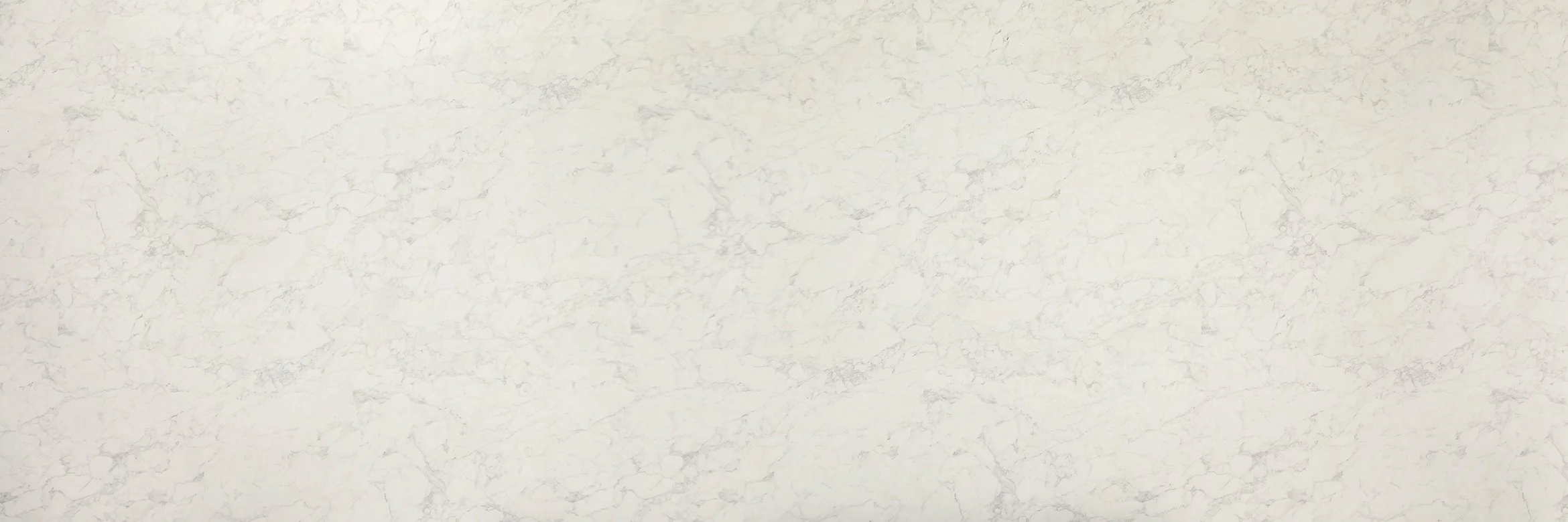 A white marble surface with gray veining.