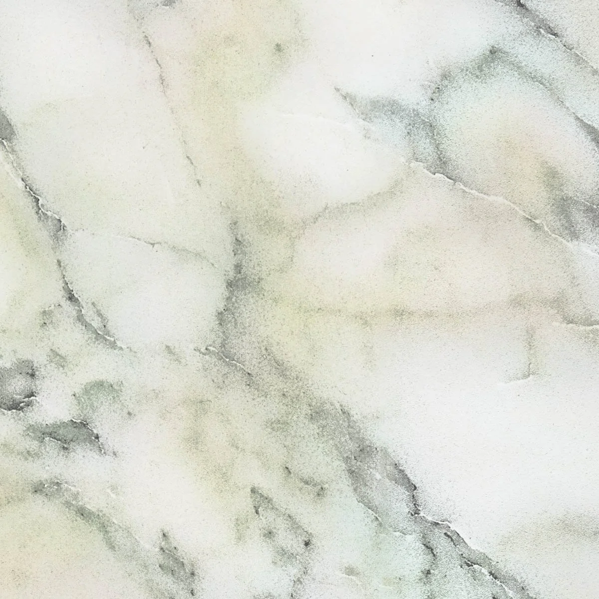 Close-up of a white marble surface with gray veining.