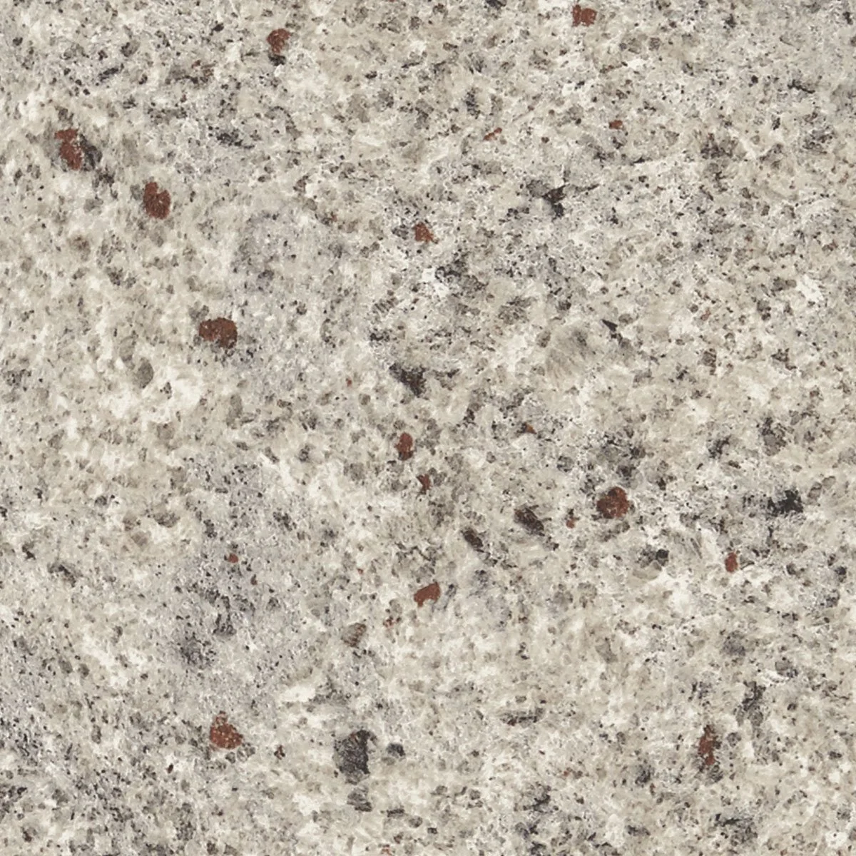 Close-up of a speckled laminate countertop with gray, white, and brown mineral particles.