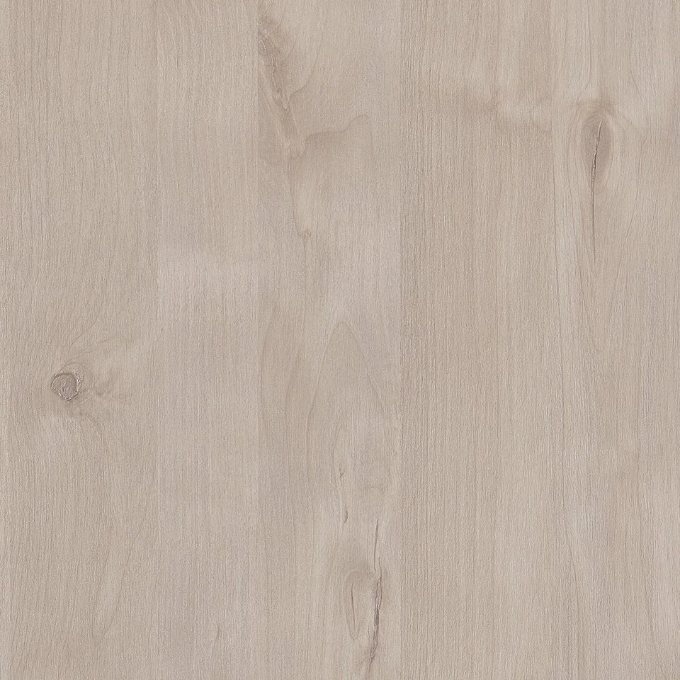 A close-up photo of a light-colored wooden surface with visible wood grain and knots.