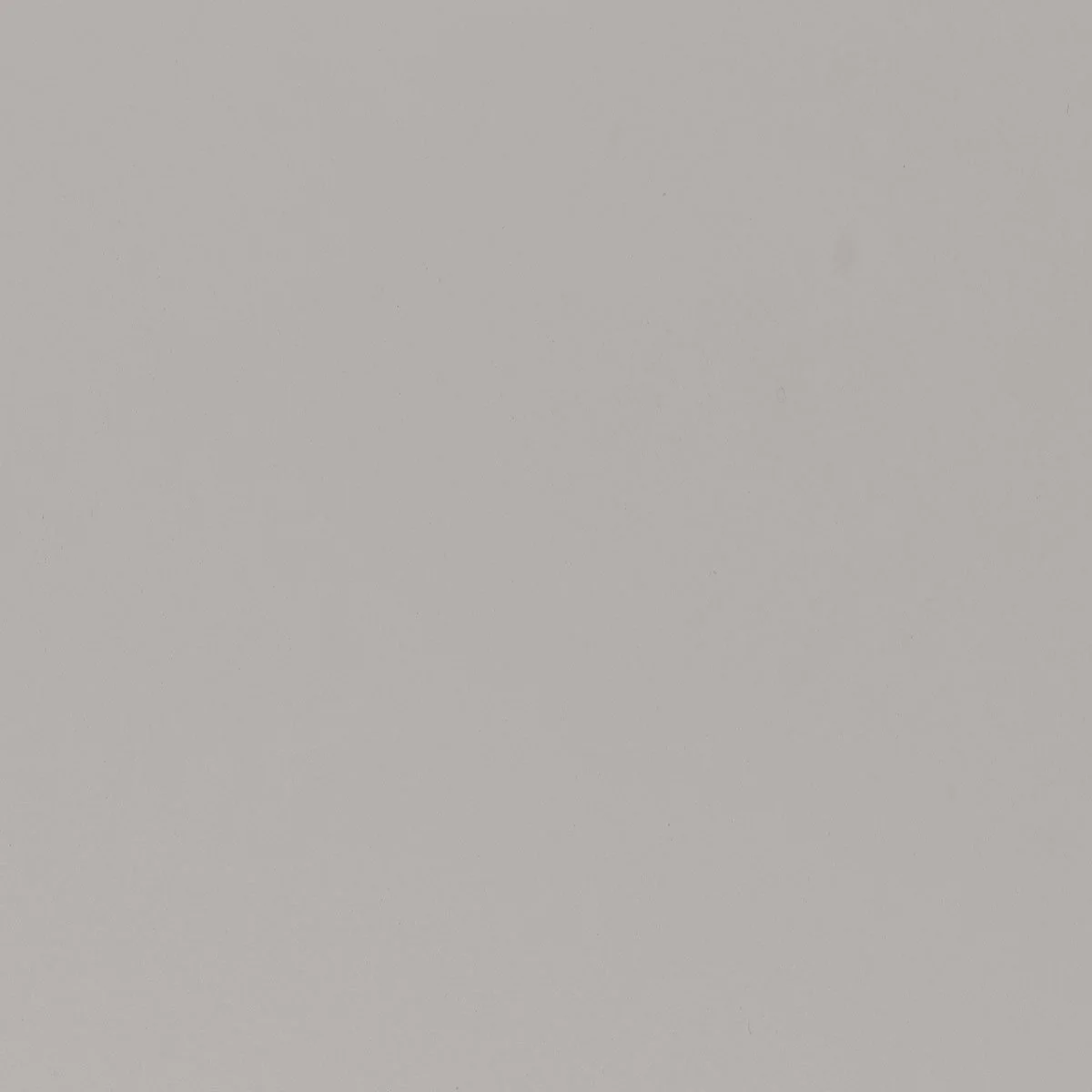 Plain light gray surface with slight variations in color and texture.