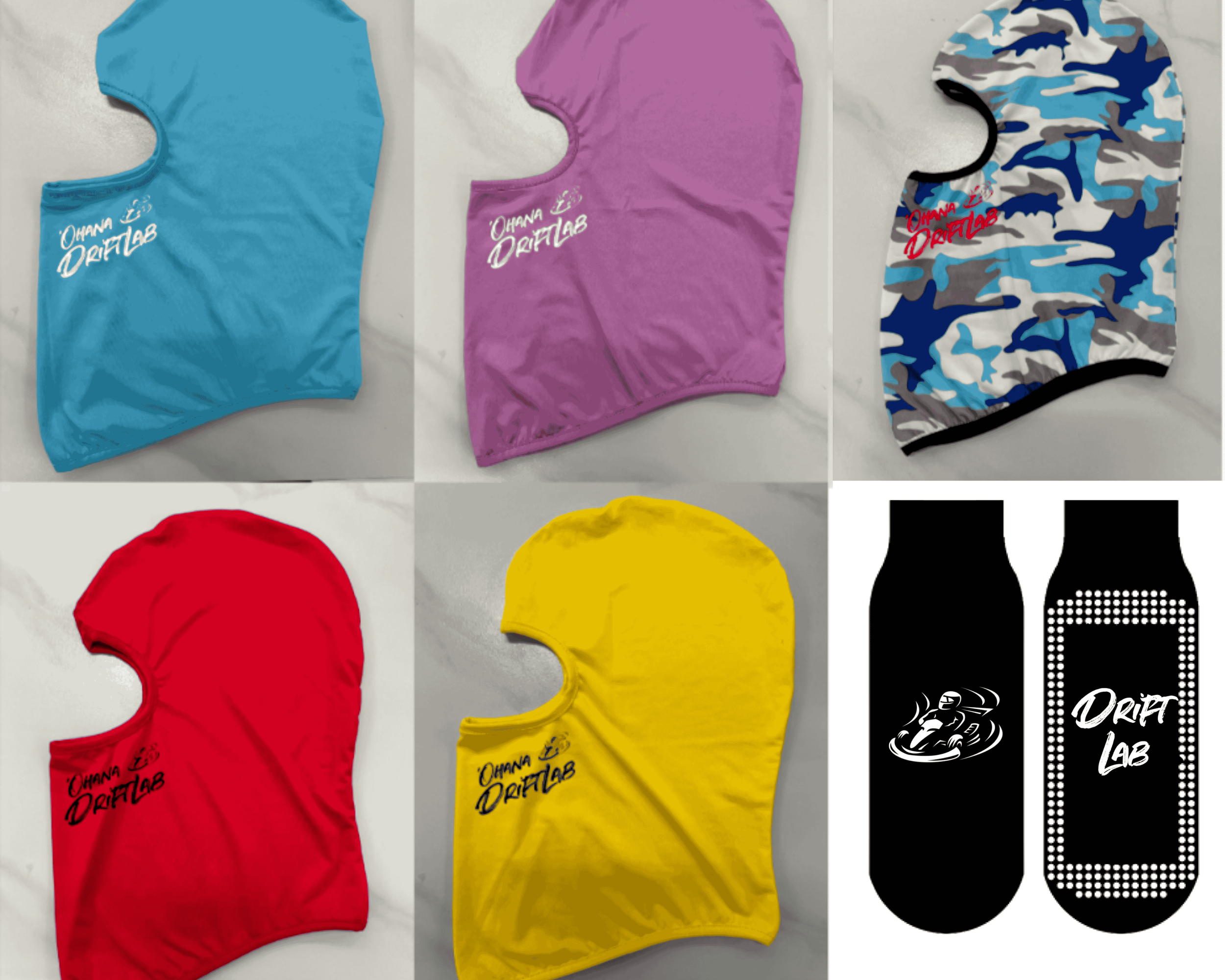 A landscape view of snow-capped mountains behind rolling green and brown hills with a modern building on a hill in the foreground.