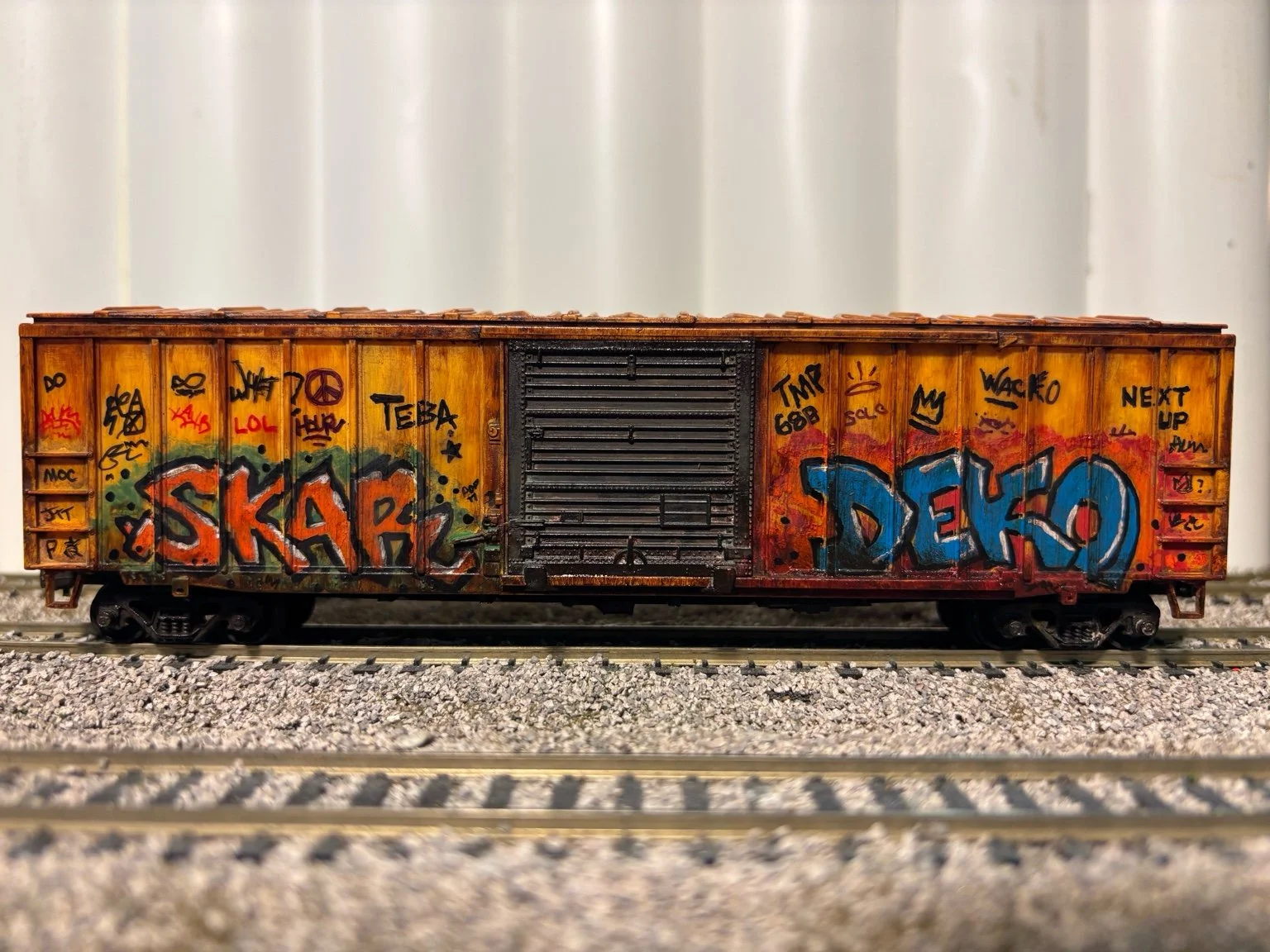 GTT-yellow-boxcar-weathered-graffitti-HO.jpeg