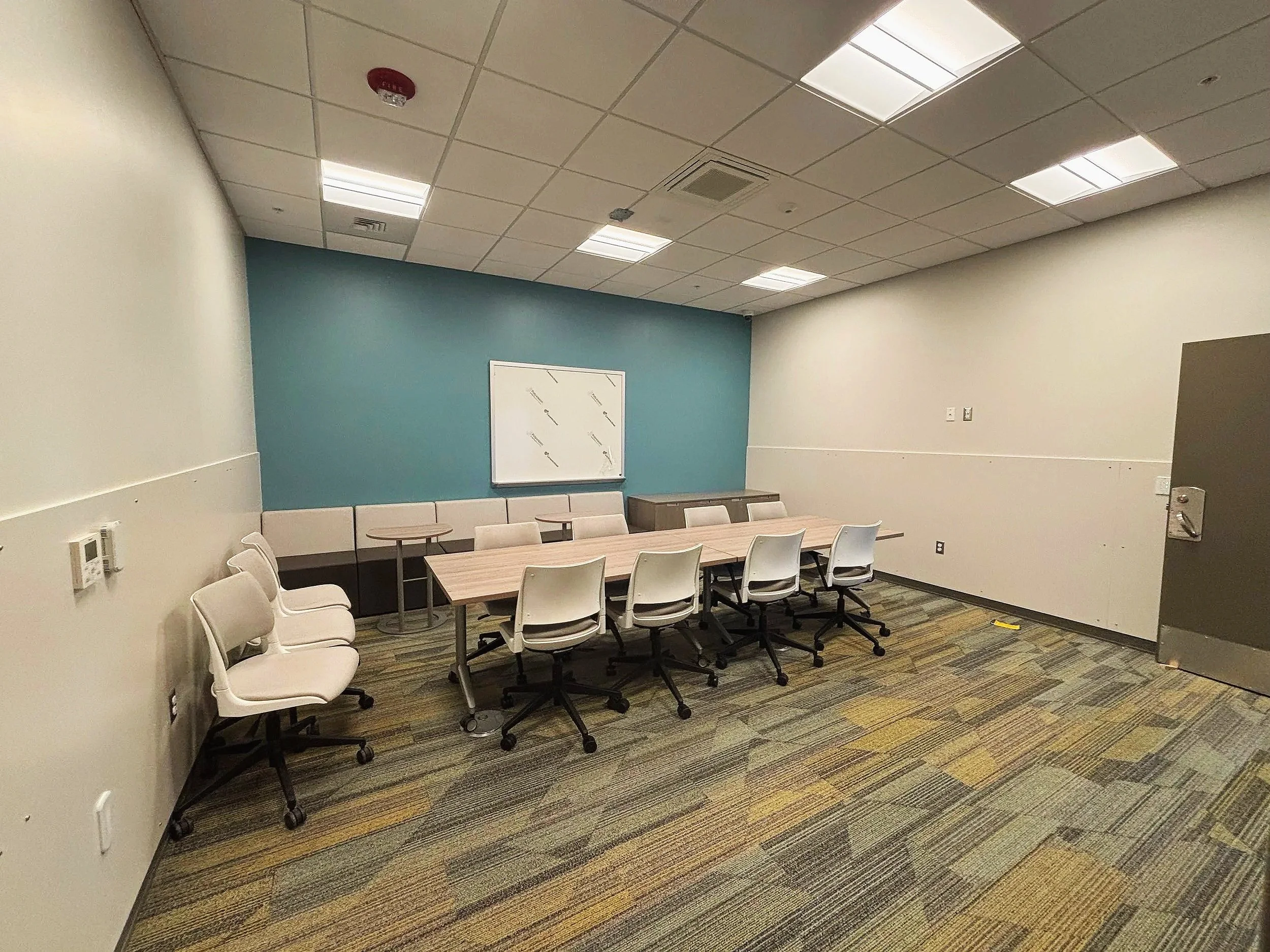 Commercial LED conference-room lighting connected to lighting-control panel
