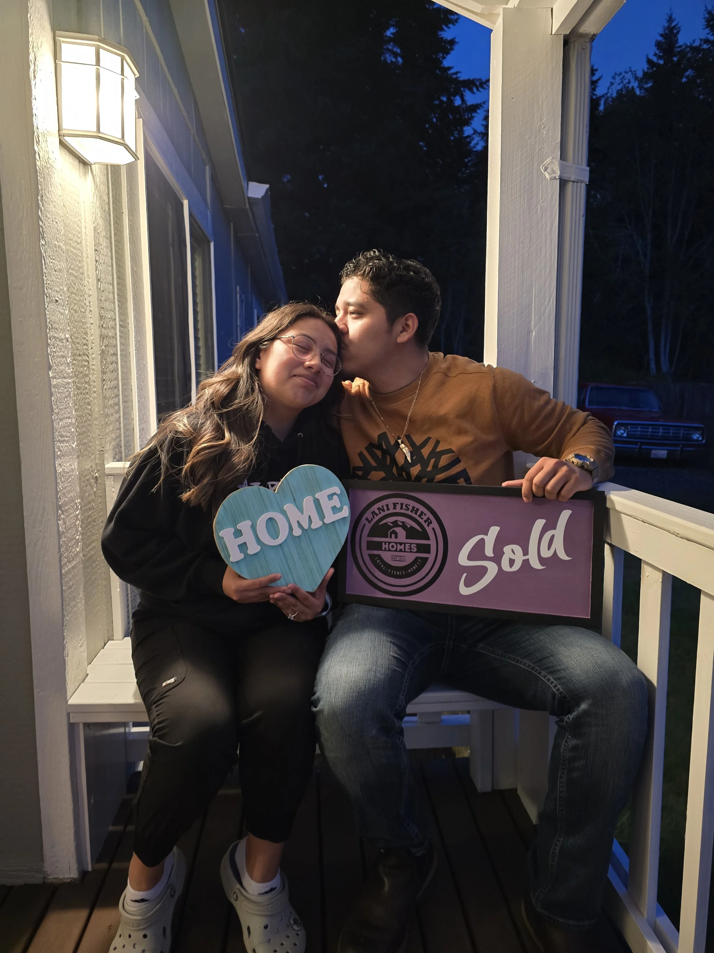 Young couple in their 20s celebrating the sale of their first home with Pacific Northwest Realtor and U.S. Veteran Lani Fisher — a real client success story from Lani Fisher Homes, helping buyers and sellers across Washington.