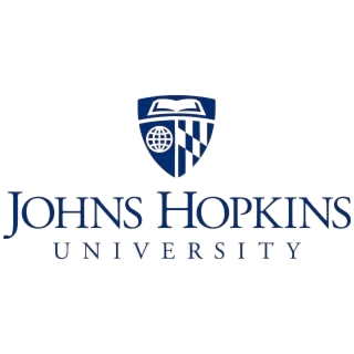 Logo of Johns Hopkins University, featuring the university's name and a shield in blue, with the top portion of the shield showing an open book, the bottom left showing a globe, and the bottom right showing a checkered pattern