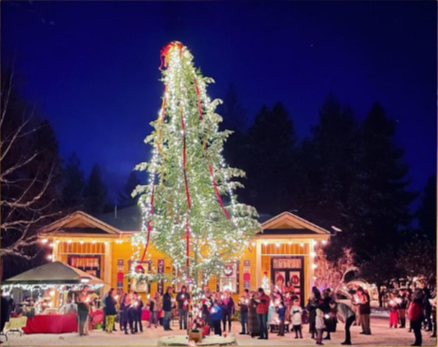 A green poster with a decorated Christmas tree on the left and event details on the right, advertising a community Christmas event on November 14th from 6 to 8 pm at 9 Mile Schoolhouse in Huson, Montana, featuring candlelighting and cheer.