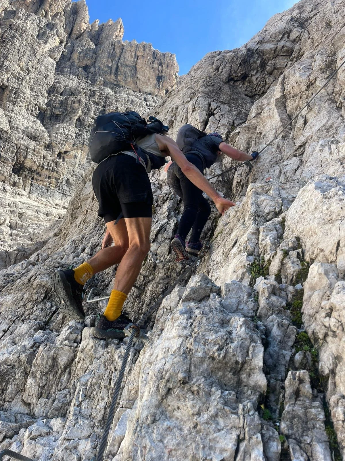 Trail runner guide Anthony Baker on trail adventure Brenta Dolomites with trail runner
