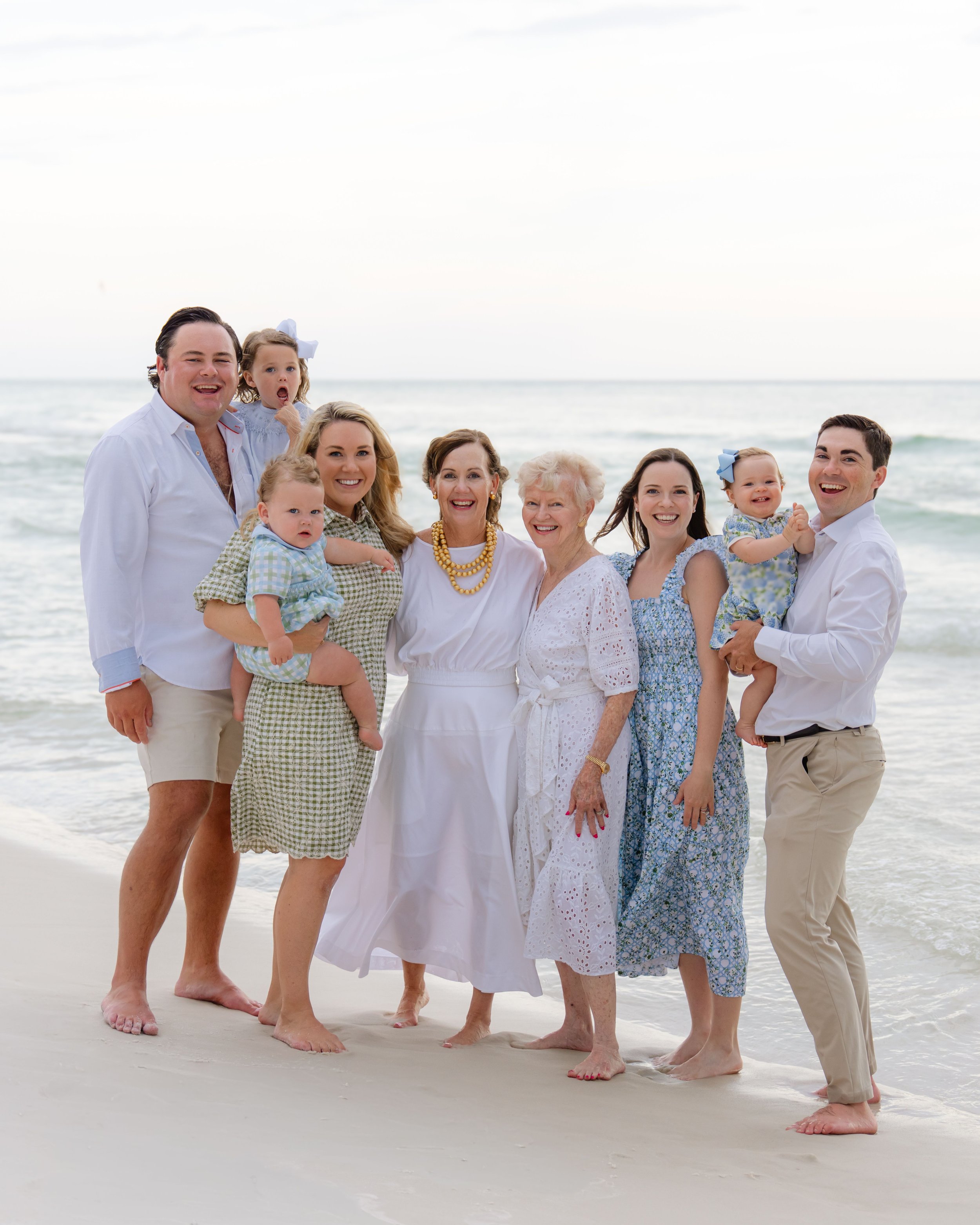 Family photo on the beach at sunset.