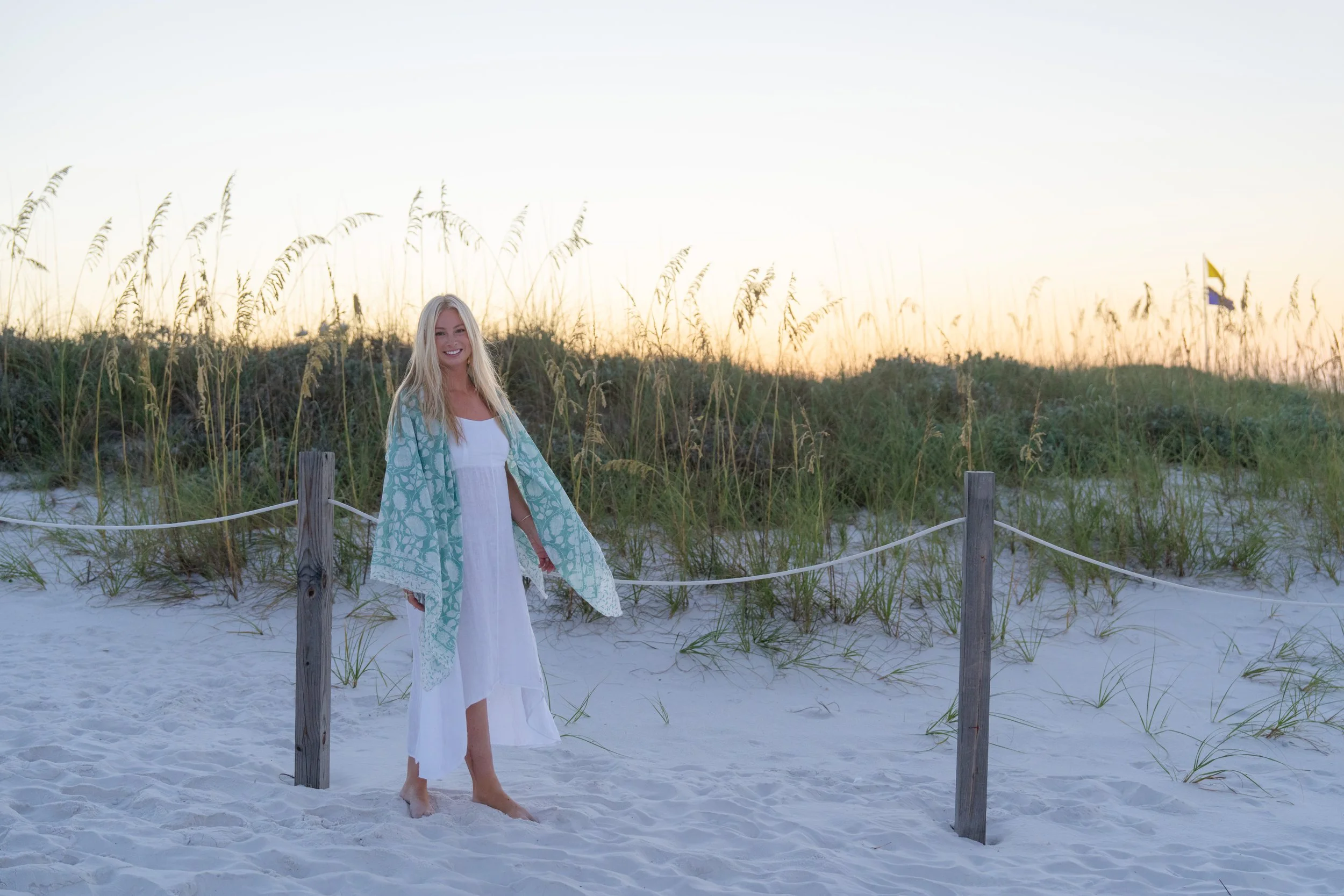 Portrait of a woman walking on a path through dunes to the beach. Grayton Beach Photographer. 30A Photographer