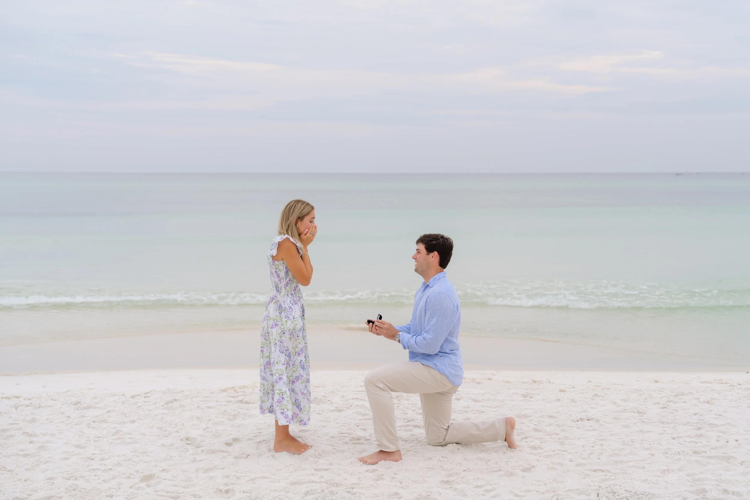 Man on one knee proposing to woman on the beach in Seagrove, Florida. 30A Photographer 30A Engagement Photographer