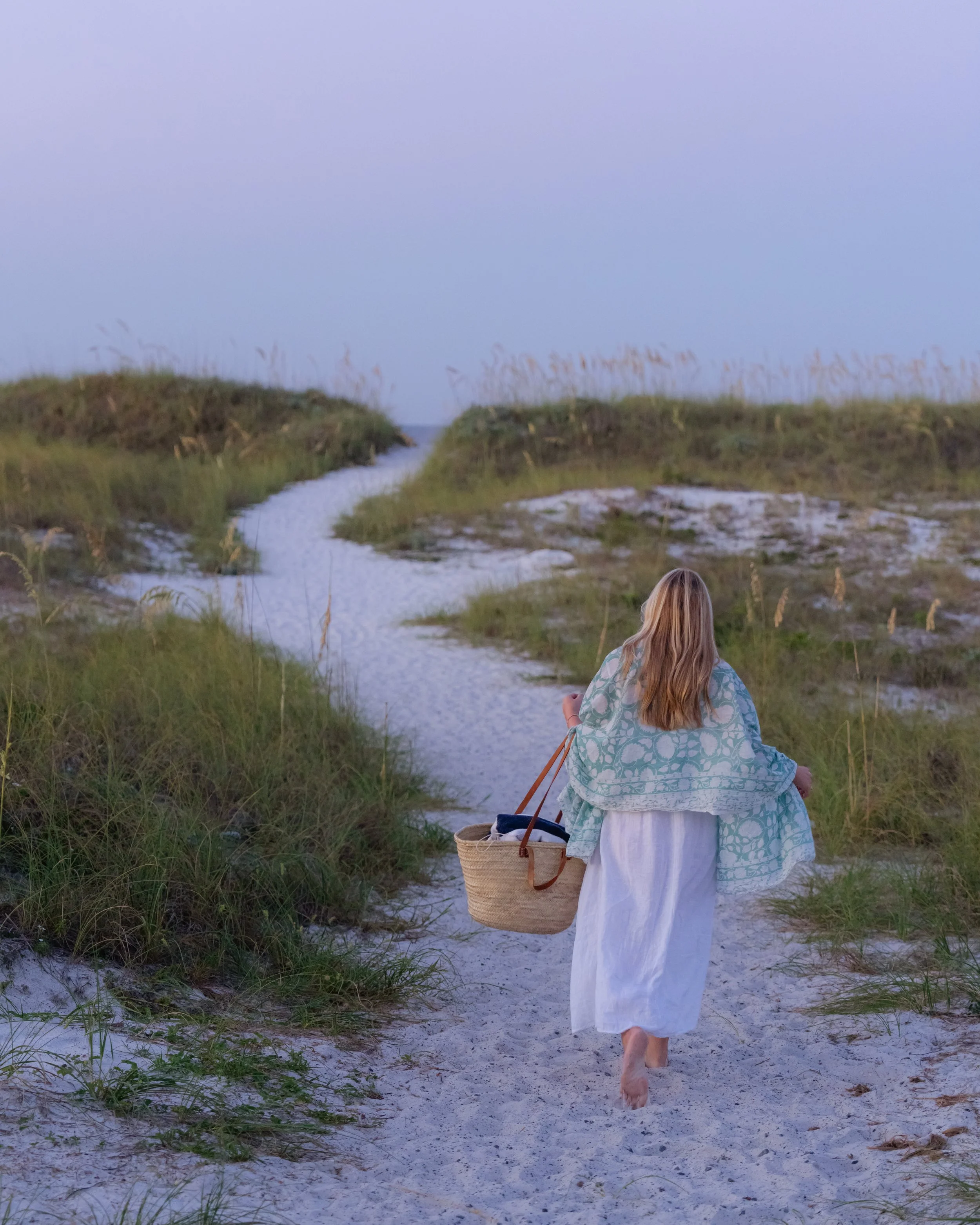 Portrait of a woman walking on a path through dunes to the beach. Grayton Beach Photographer. 30A Photographer