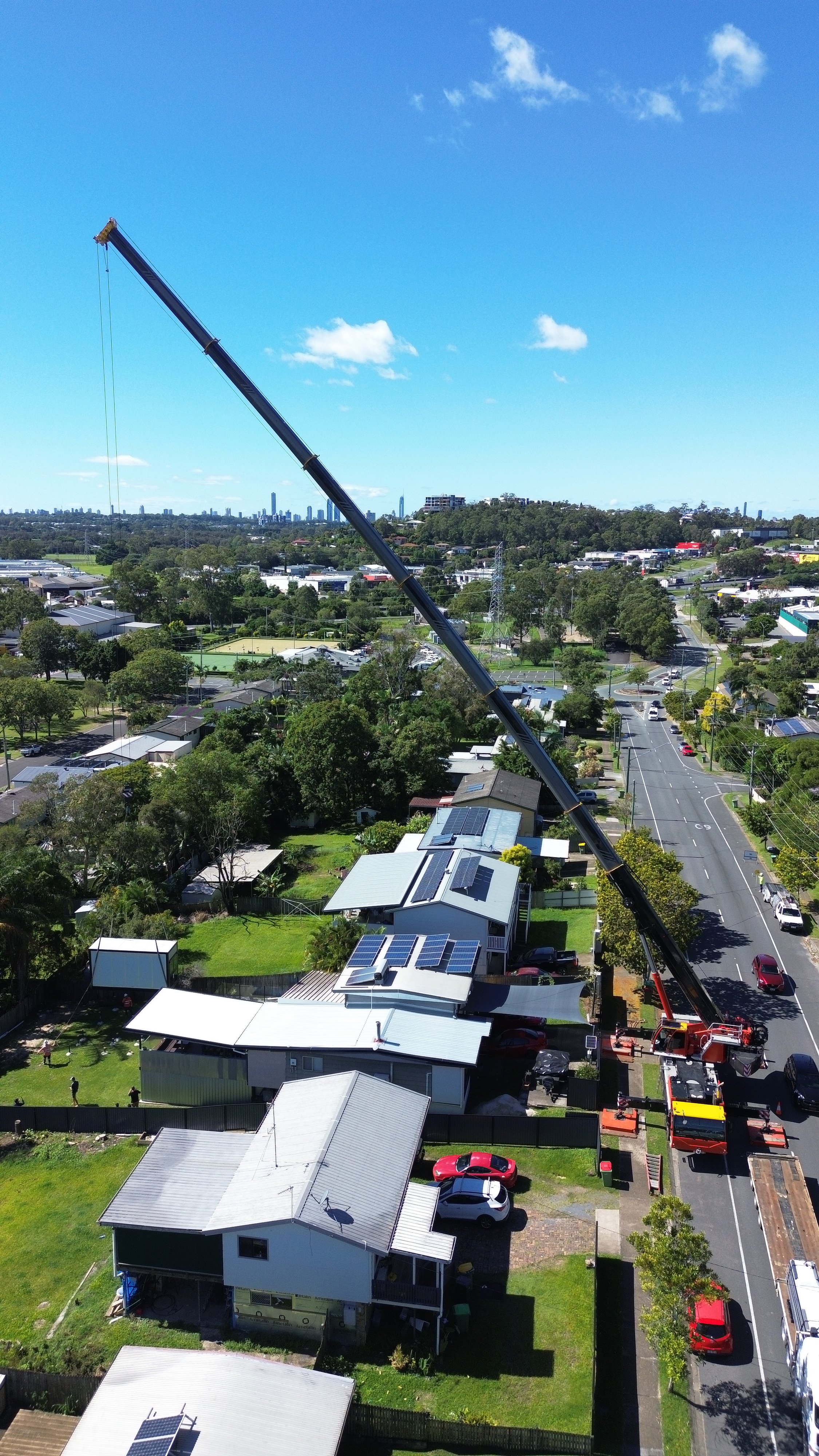 An image of a crane lifting modular prefab home