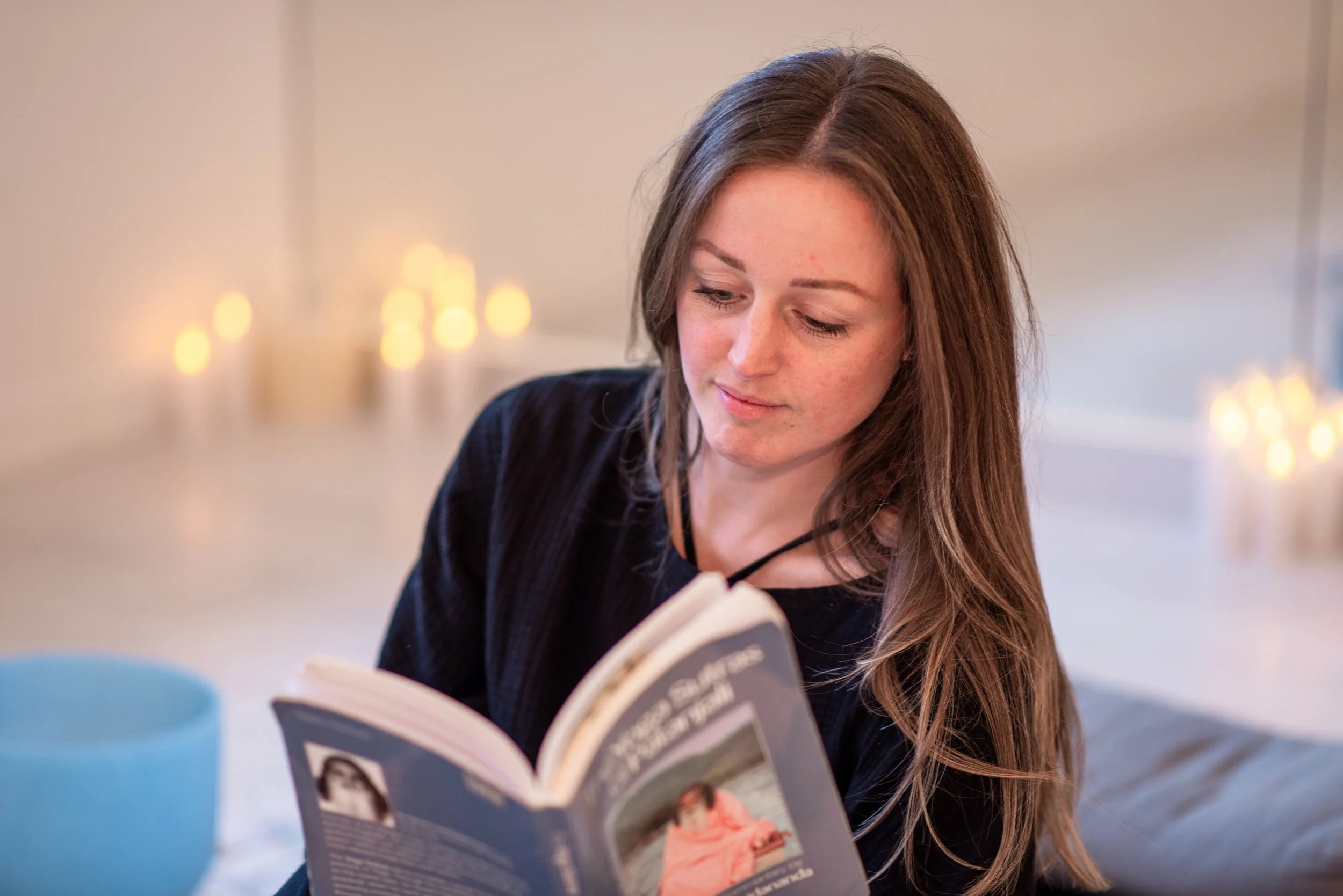 A woman reading the Yoga Sutras of Patanjali, deepening her yoga practice worldwide, currently living in England.
