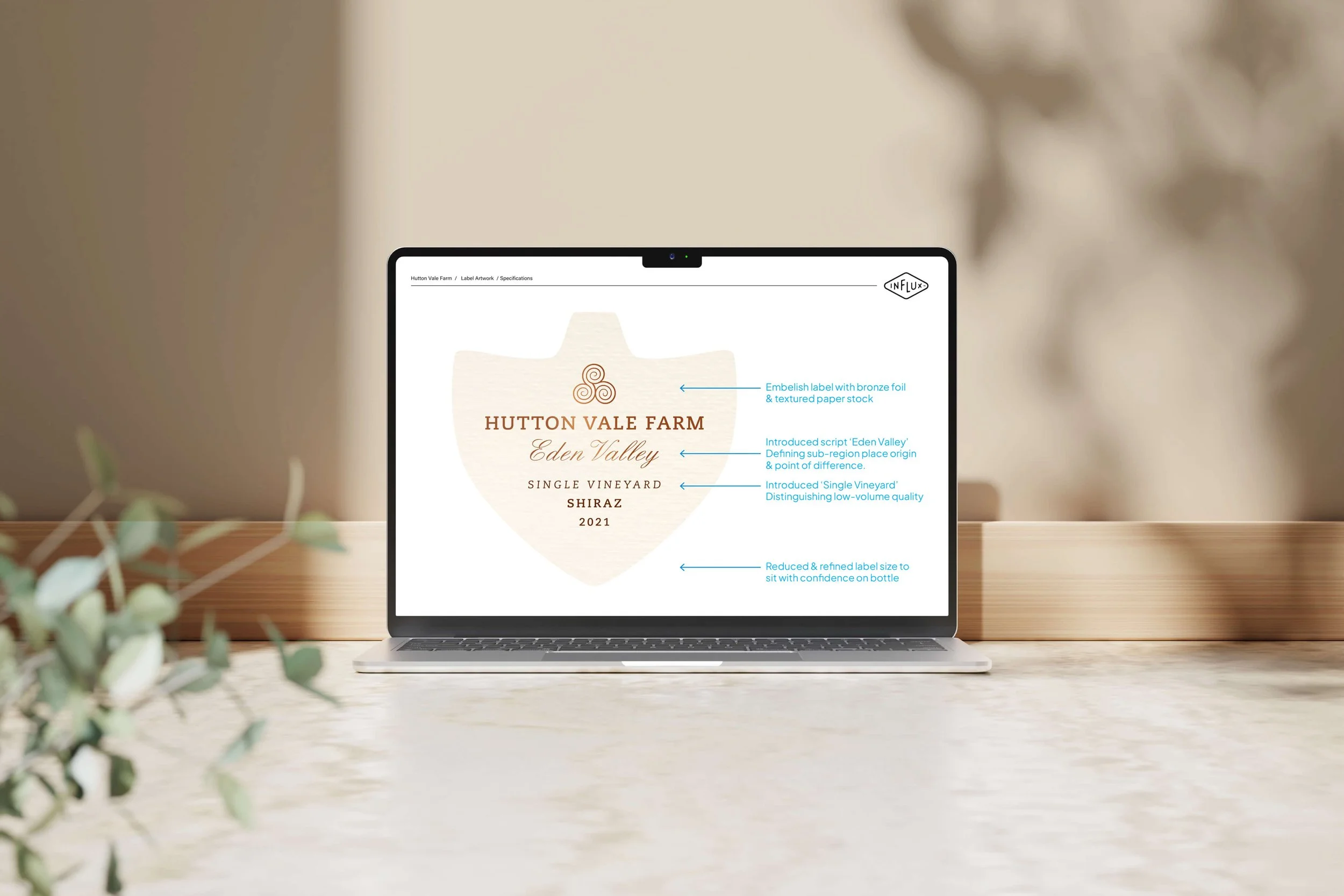 Laptop displaying a wine label design for Hutton Vale Farm, Eden Valley, single vineyard Shiraz 2021, with design annotations.