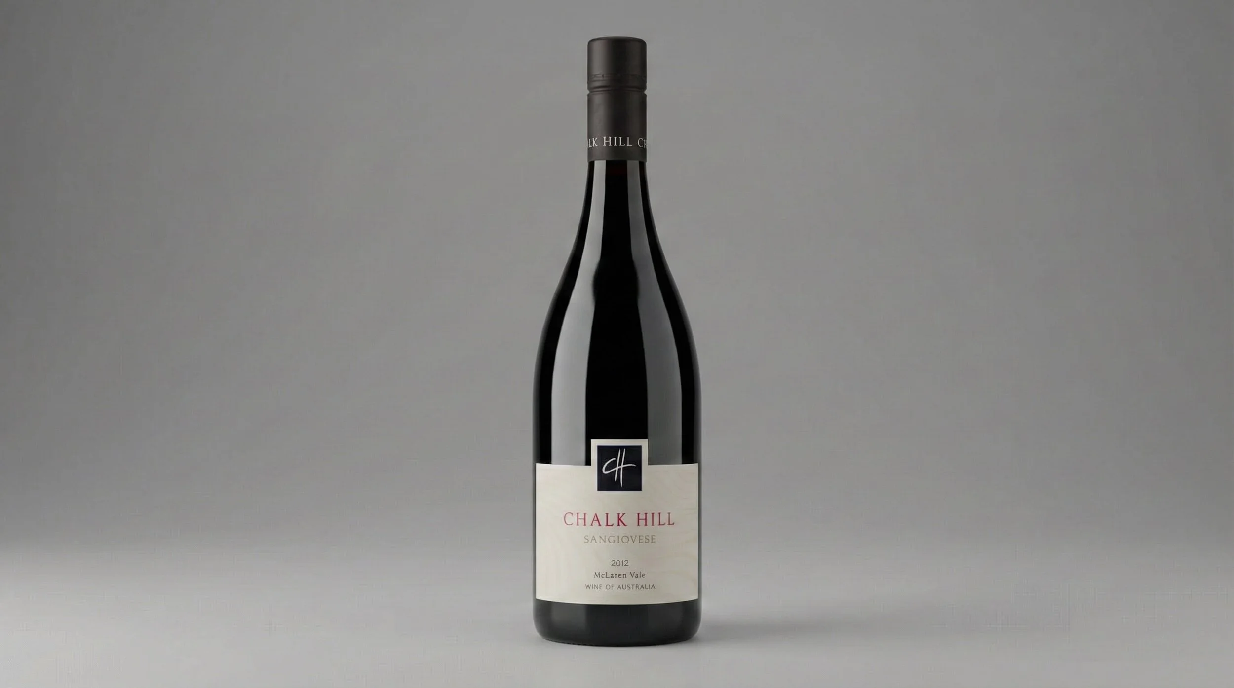 A bottle of Chalk Hill Sangiovese wine from Australia, vintage 2012, standing upright on a gray background.