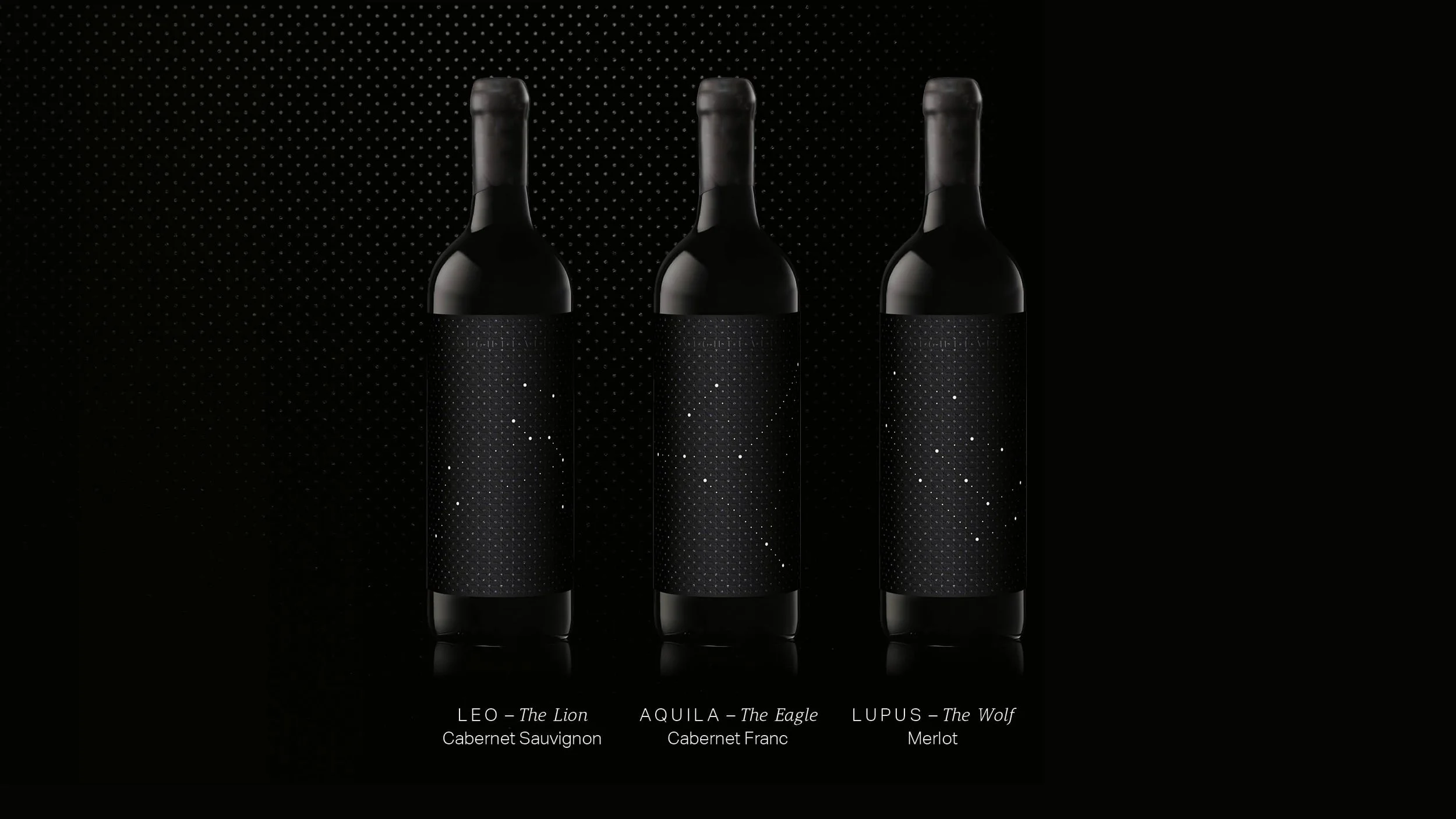 Three black wine bottles with starry night-themed labels, labeled Leo - The Lion Cabernet Sauvignon, Aquila - The Eagle Cabernet Franc, and Lupus - The Wolf Merlot, against a black background with a dotted pattern.