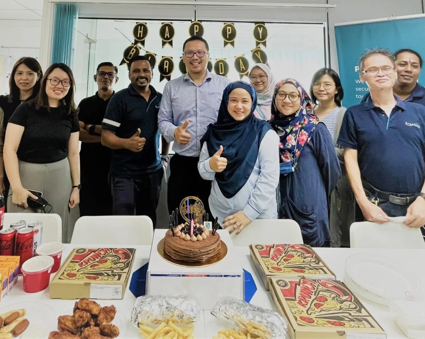 Corinthian staff celebrating a team members birthday.