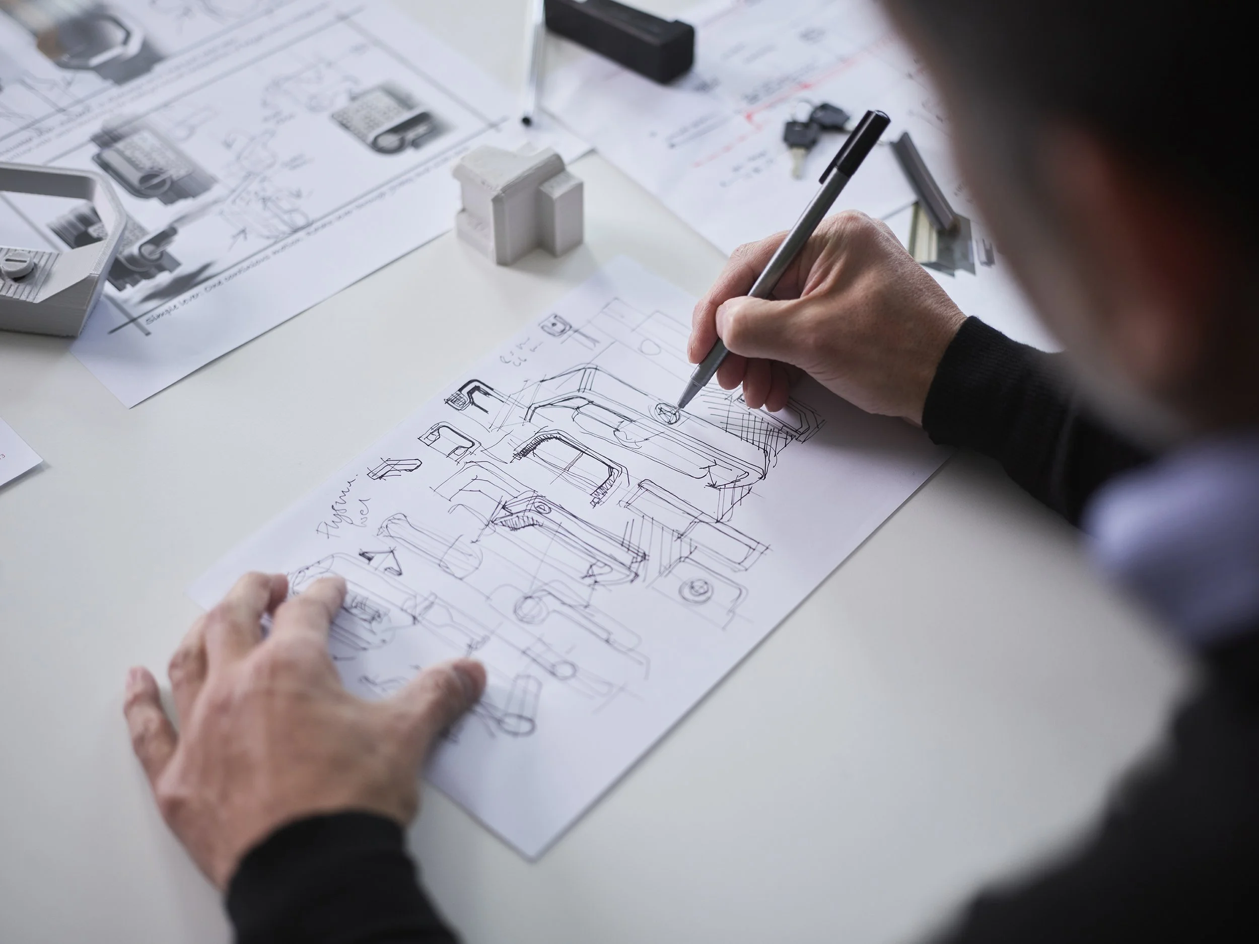 VENTORA product development staff member designing hardware.