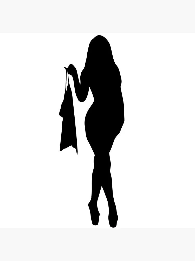 Silhouette of a woman holding a piece of clothing.
