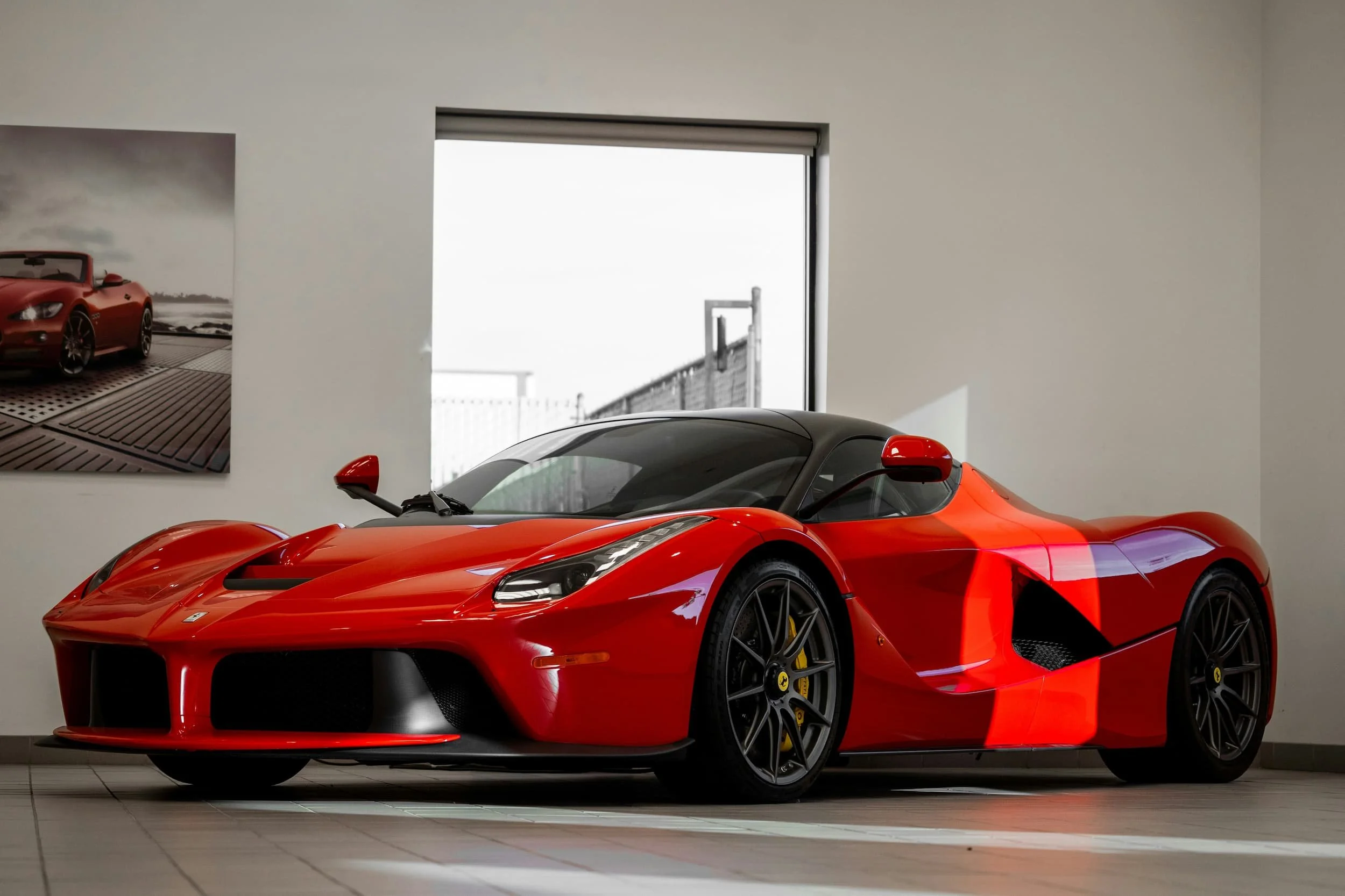 Ferrari LaFerrari displayed in a showroom, highlighting the types of supercars available through authorised and prestige dealerships in Australia.