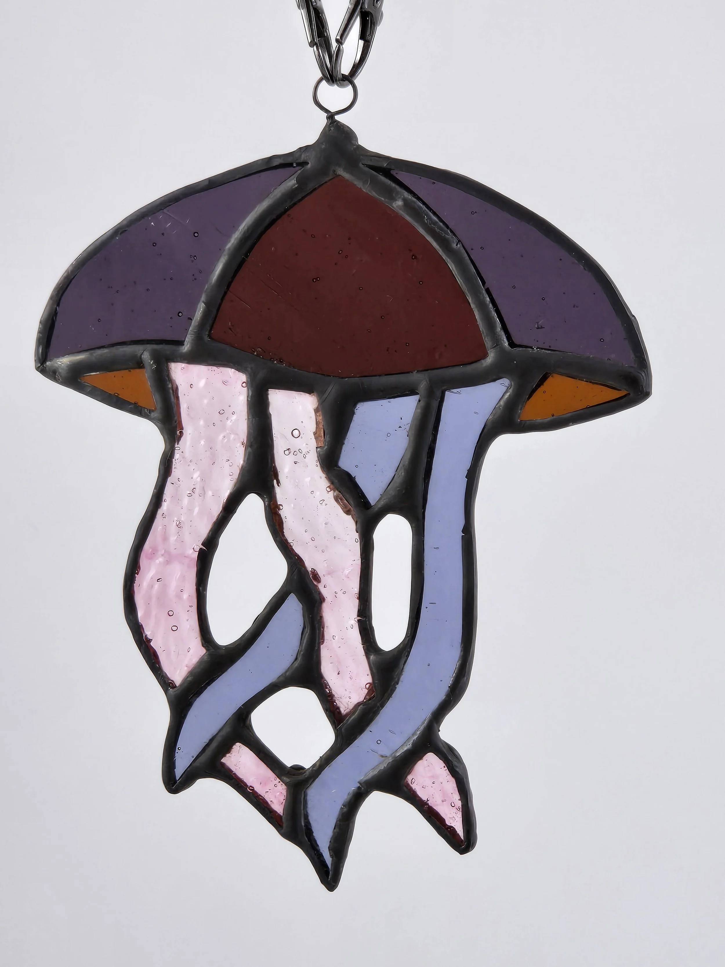 Stained glass suncatcher of a jellyfish.