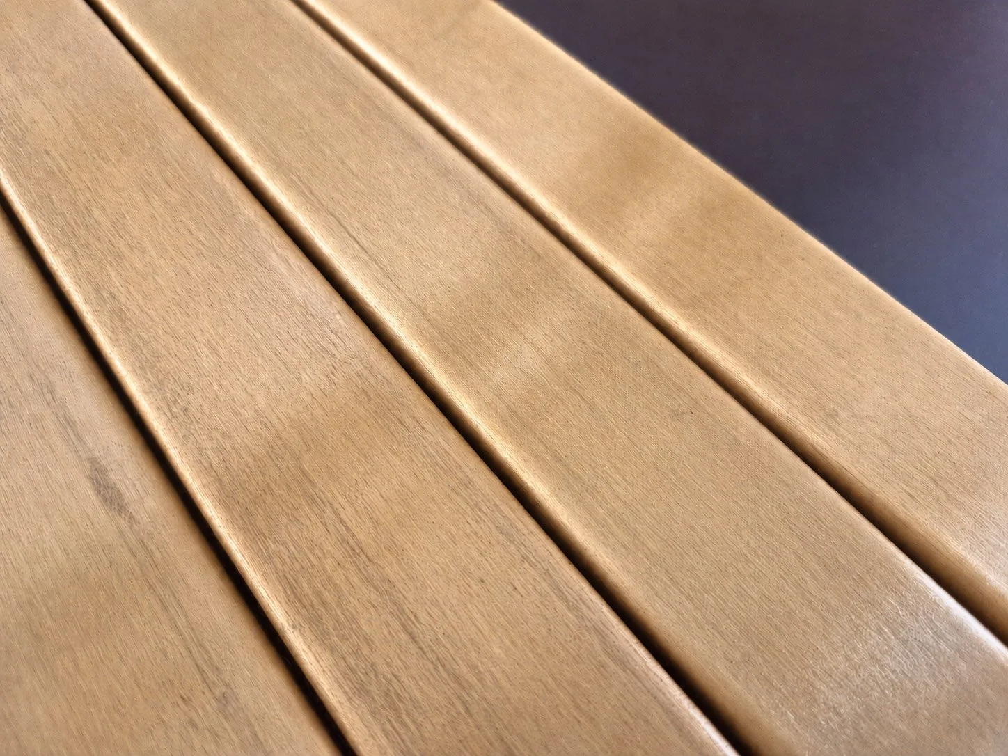 Close-up of a wooden surface with horizontal planks.