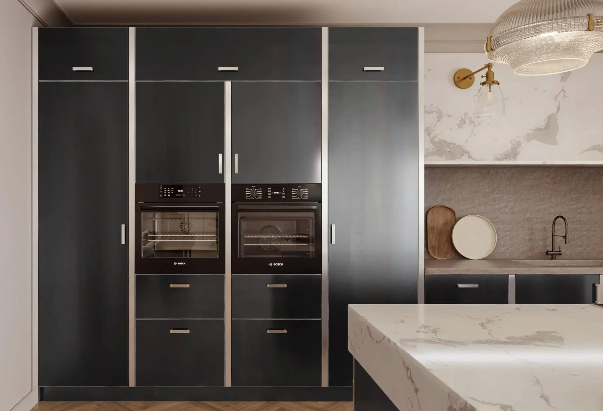 Full-height steel kitchen units with integrated appliances and seamless storage designed for a clean architectural appearance.