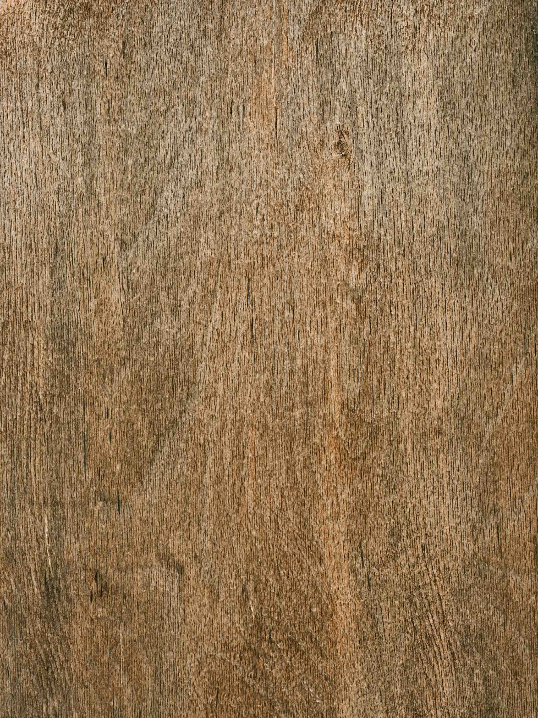 Close-up of a wooden surface with visible grain and texture.