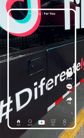 A close-up of a black sign with white text that reads #Difference, located at a street or outdoor area, with a basketball logo and a white frame overlay.