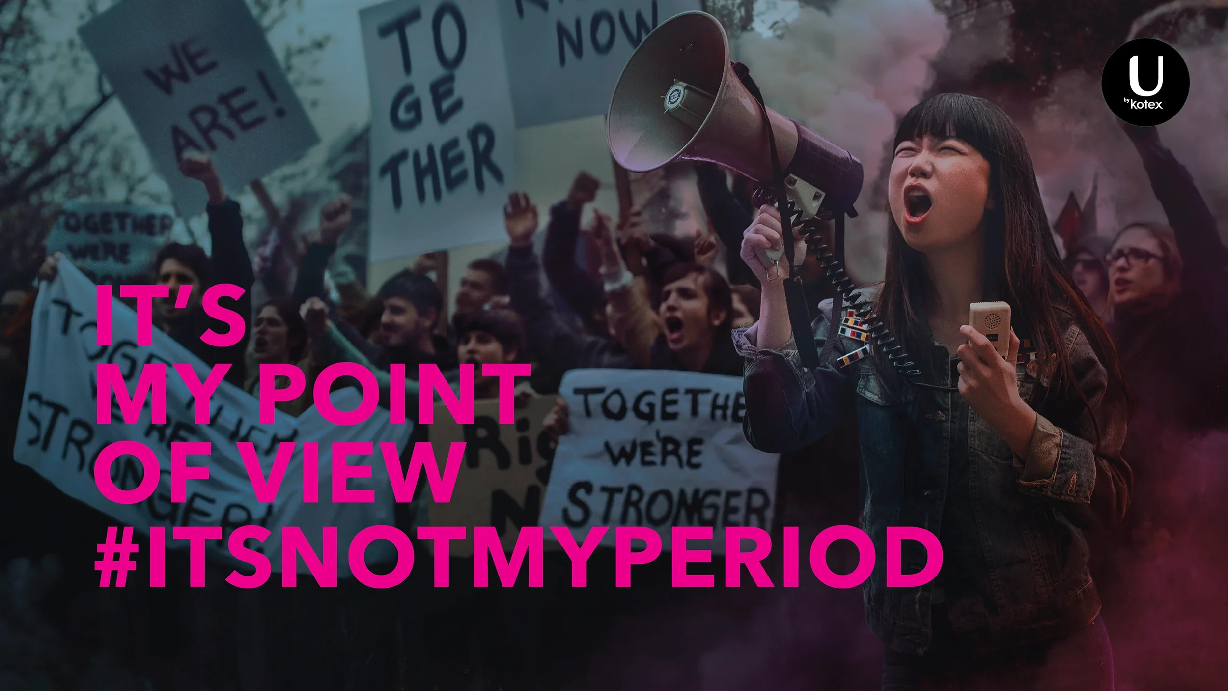 A young woman with dark hair, wearing a denim jacket, is shouting into a megaphone at a protest. She holds a microphone in one hand and the megaphone in the other. Behind her, a crowd of people is holding signs with messages like 'We Are!', 'Together We're Stronger,' and 'To Get There.' The overlay text in bright pink says 'IT'S MY POINT OF VIEW #ITSNOTMYPERIOD'.