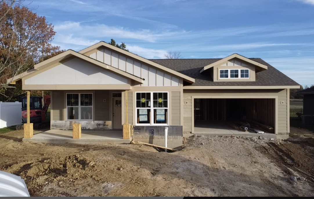 Before construction simulation rendering showing finished home façade.