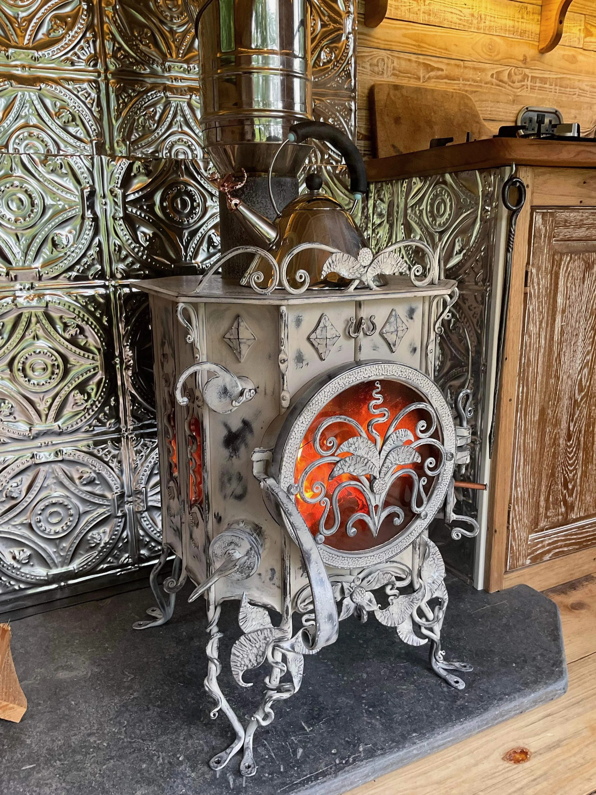 Hand-forged wood stove burner