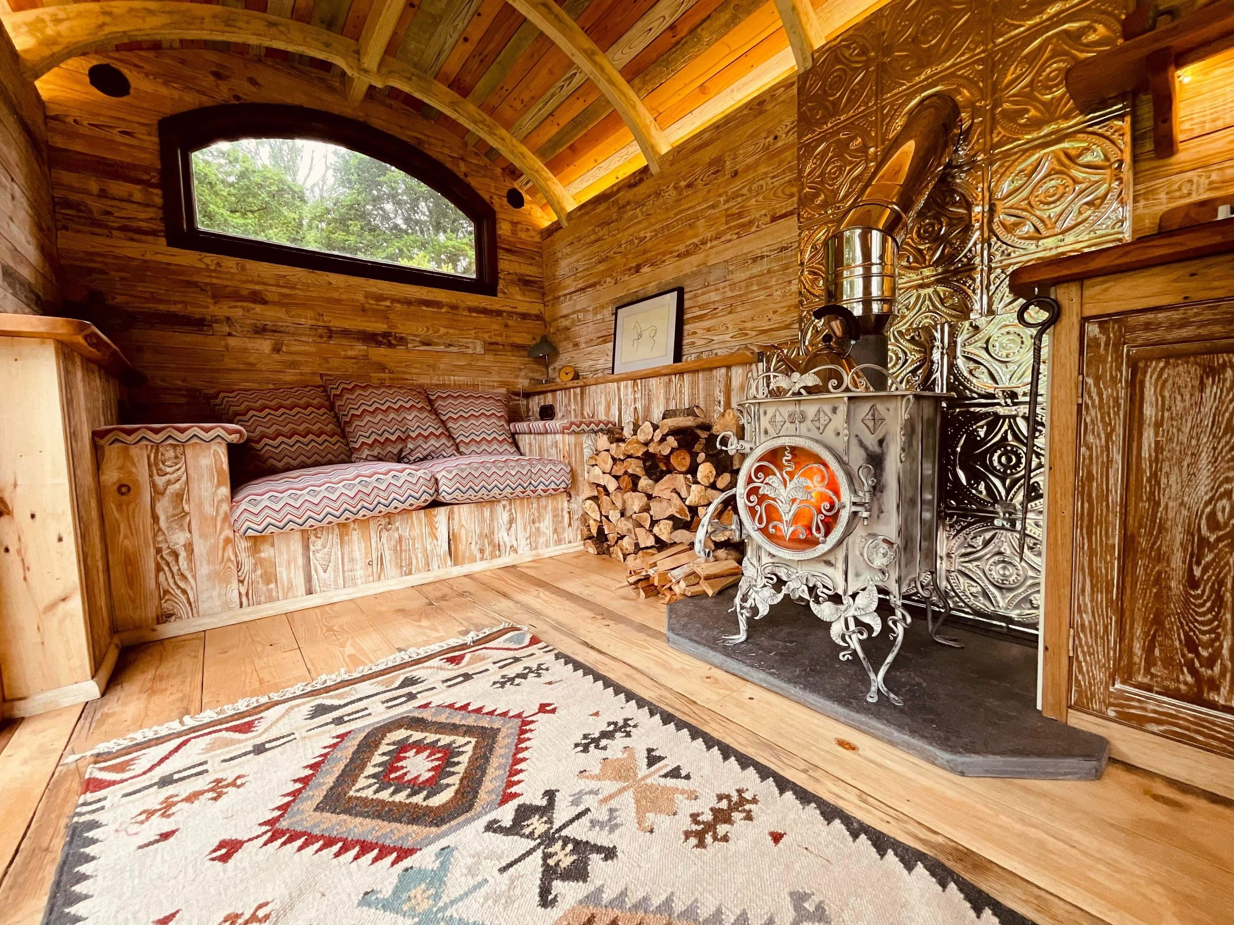 Bespoke wood stove burner on a local slate hearth
