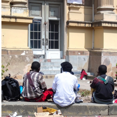 unemployed workers sitting outside