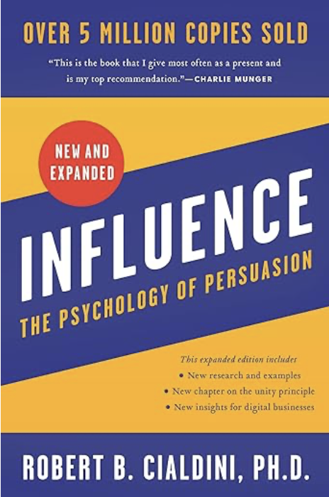 Book cover titled 'Influence: The Psychology of Persuasion' by Robert B. Cialdini, Ph.D., with a blue and yellow design and a red circle indicating 'New and Expanded' edition.