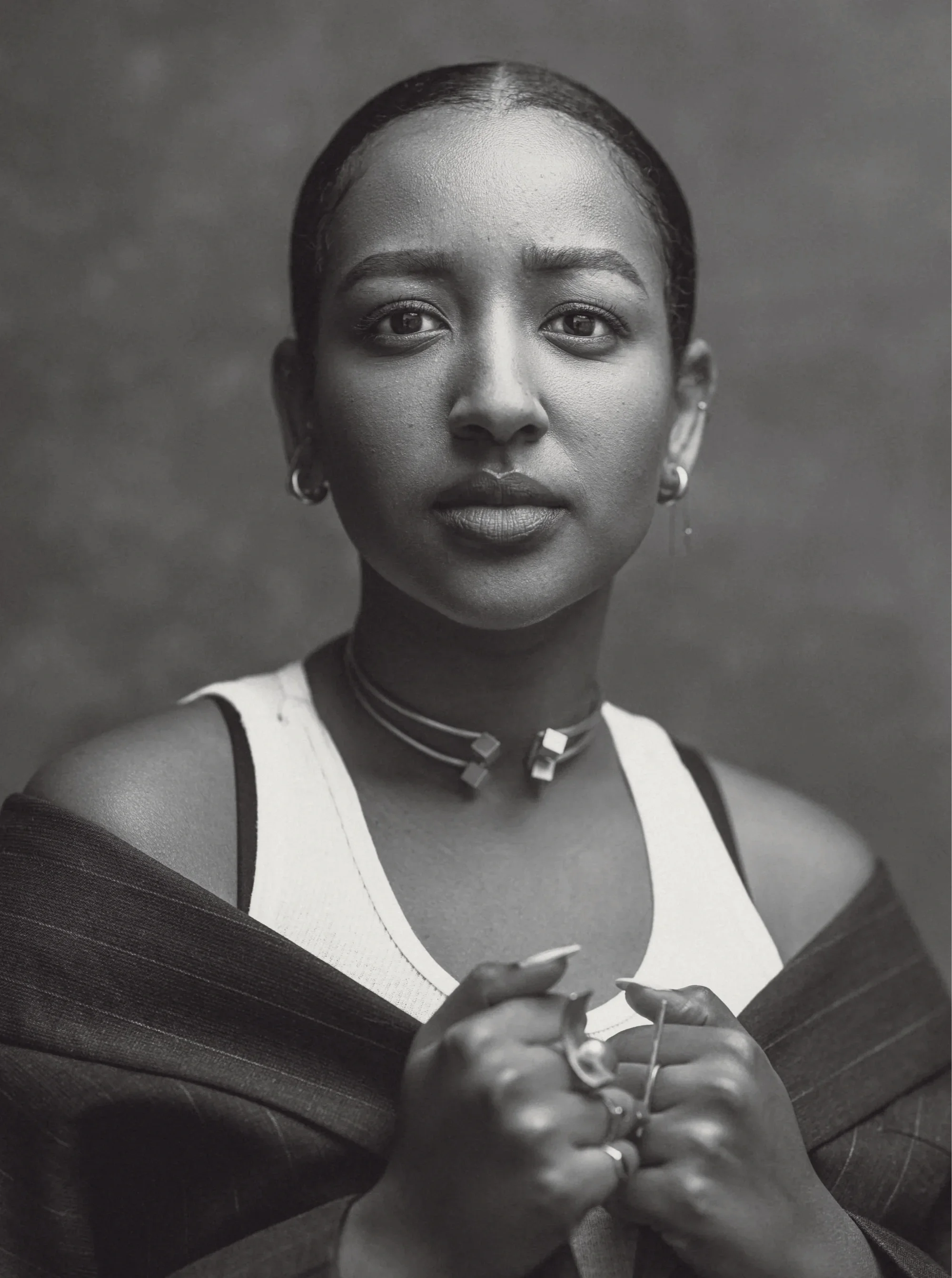 Black and white photo of Mignotae Kebede, director of Skylark The Film, facing the camera