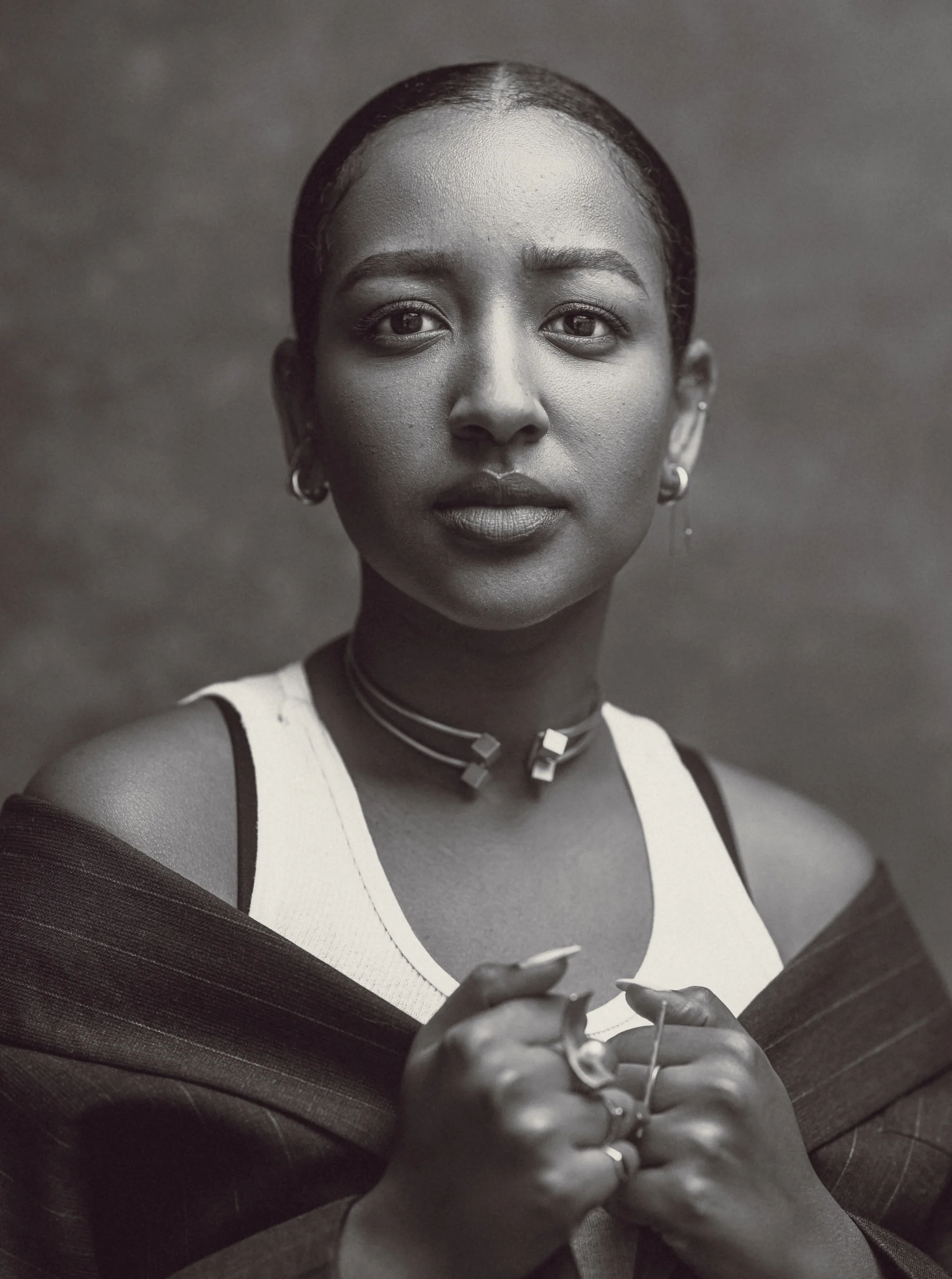 Black and white photo of Mignotae Kebede, director of Skylark The Film, facing the camera