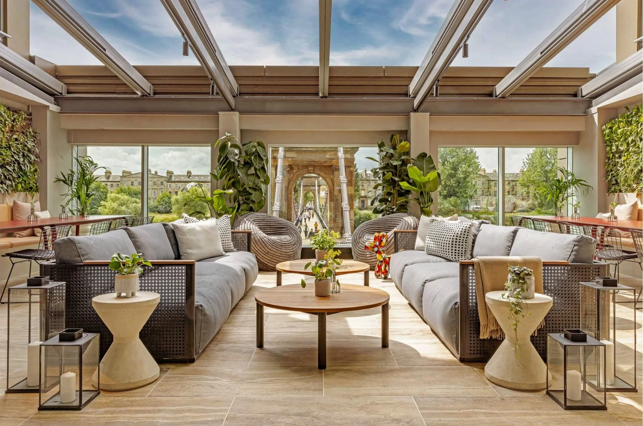 Lounge with green living walls and openable glass roof in Virgin Hotel Glasgow